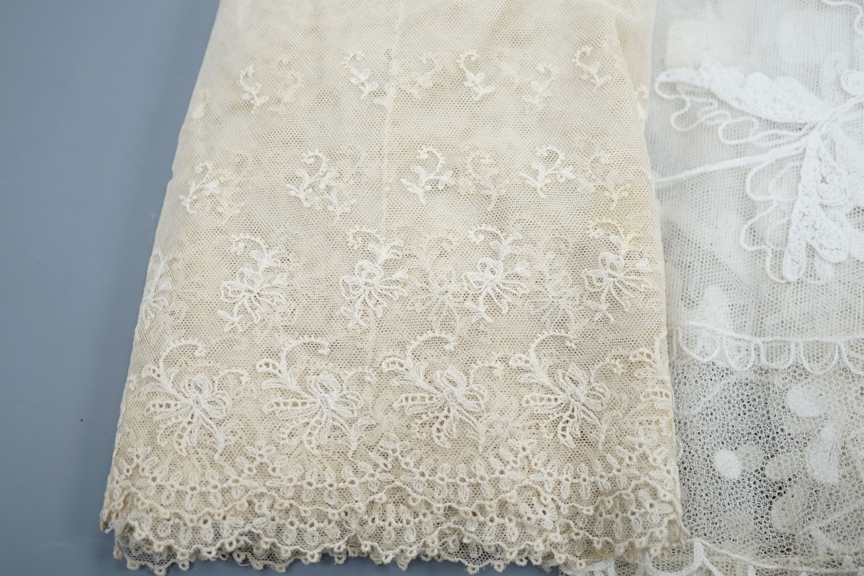 A needle lace skirt panel, a similar stole, various machine laces and trimmings